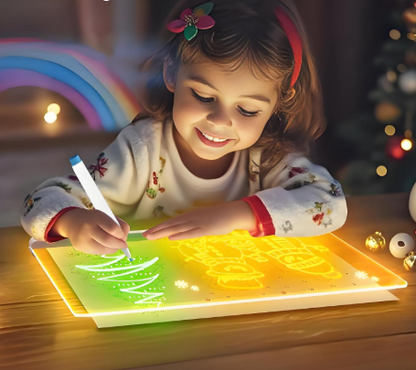 enfant qui dessine sur tablette a dessin lumineux